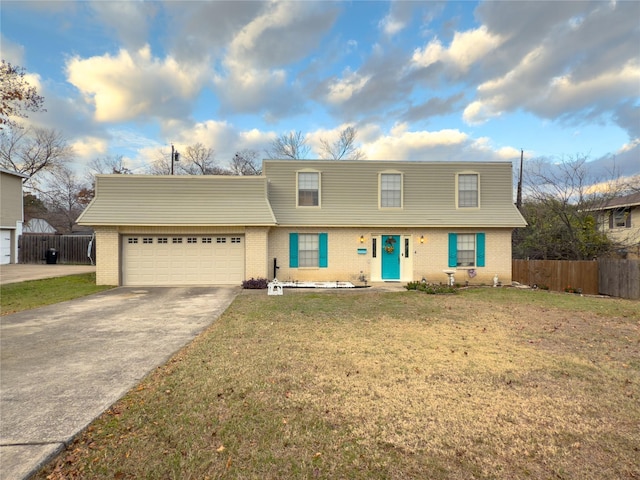 view of front of house featuring a garage and a front lawn