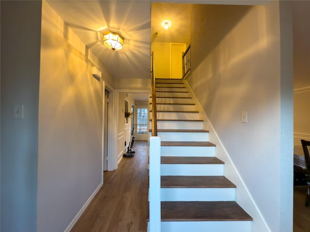 stairway with wood-type flooring