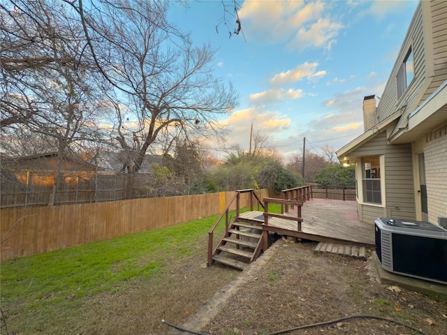 view of yard featuring a wooden deck and cooling unit