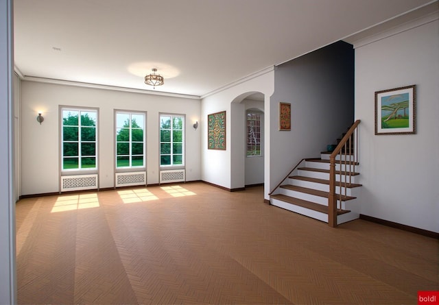 interior space with light parquet flooring and ornamental molding