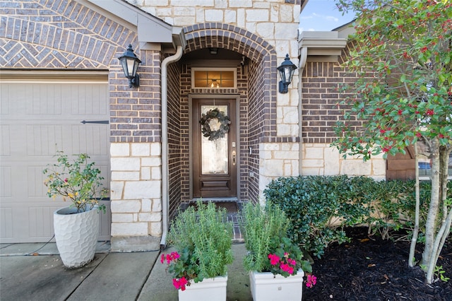 doorway to property featuring a garage