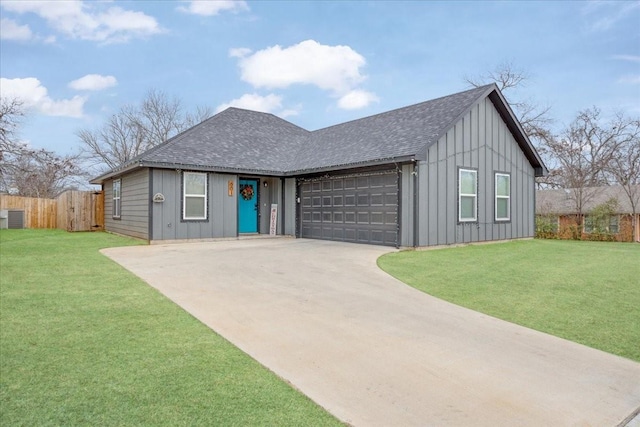 view of front of house featuring a front yard and a garage