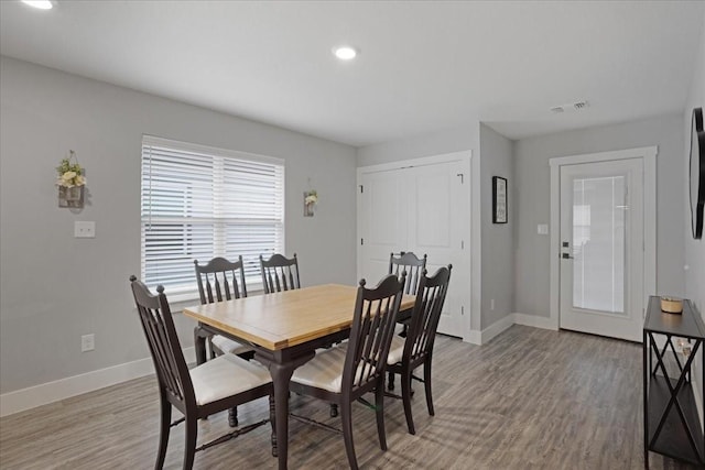 dining area featuring light wood-type flooring