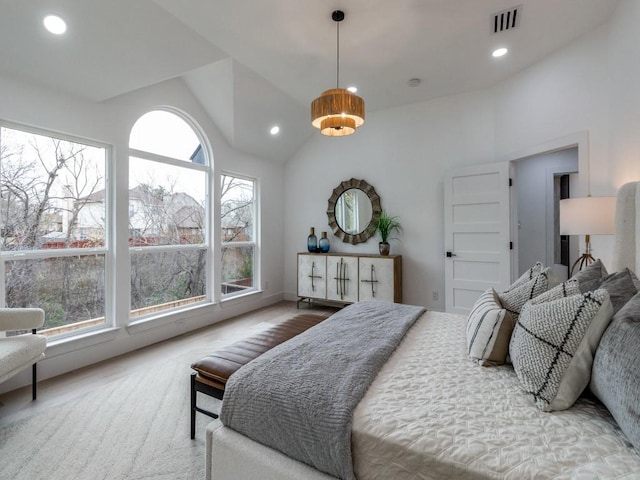 bedroom featuring hardwood / wood-style floors and vaulted ceiling