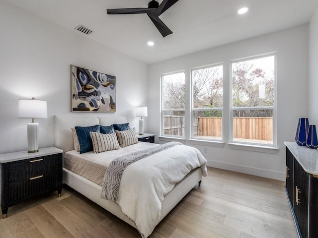 bedroom featuring light hardwood / wood-style floors and ceiling fan