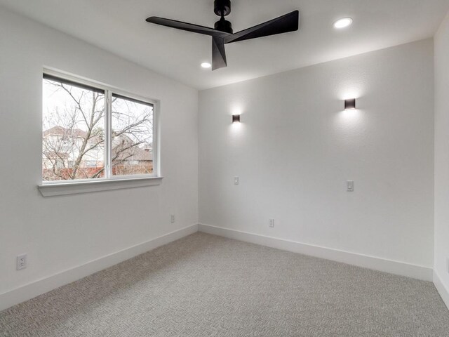 empty room featuring carpet and ceiling fan