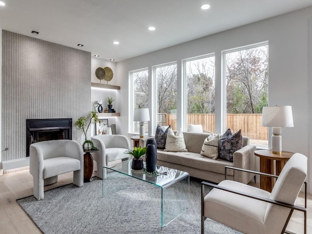 living room with light wood-type flooring and sink