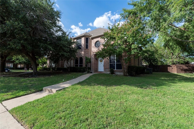 obstructed view of property with a front yard