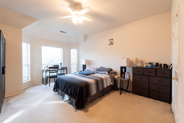 bedroom with ceiling fan and light colored carpet