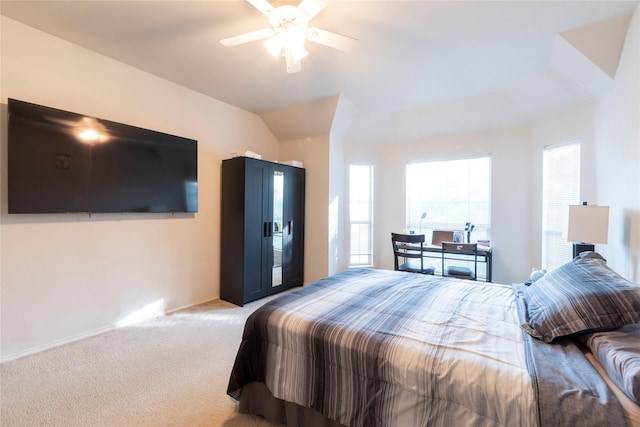 carpeted bedroom with lofted ceiling and ceiling fan