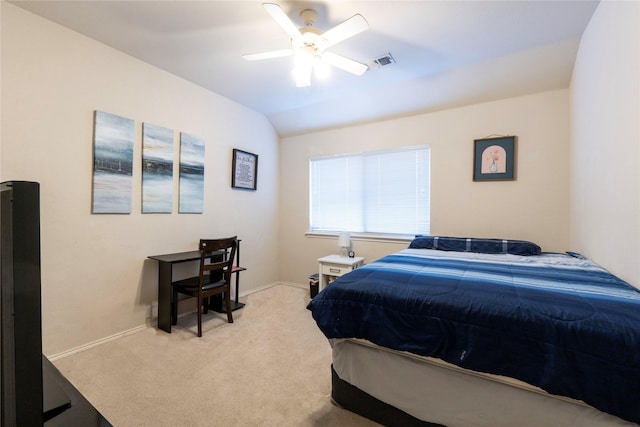 bedroom featuring ceiling fan, light colored carpet, and lofted ceiling