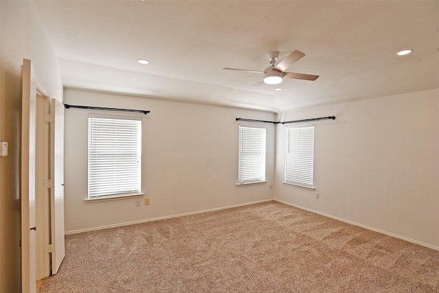 spare room with ceiling fan, recessed lighting, baseboards, and light carpet