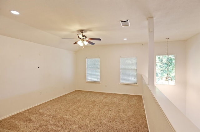 carpeted spare room featuring baseboards, recessed lighting, visible vents, and ceiling fan