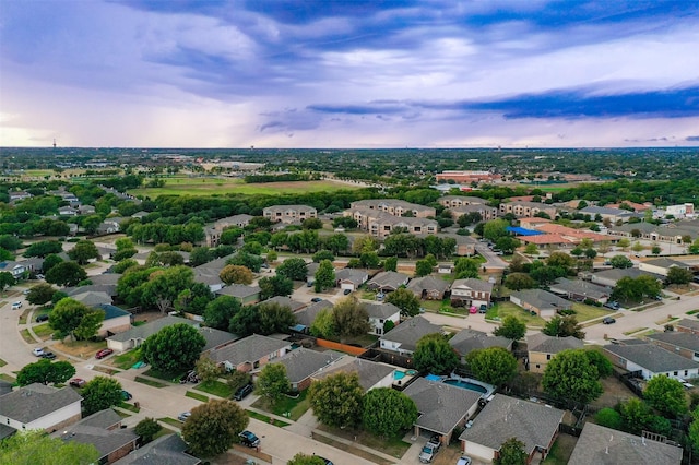 aerial view at dusk with a residential view