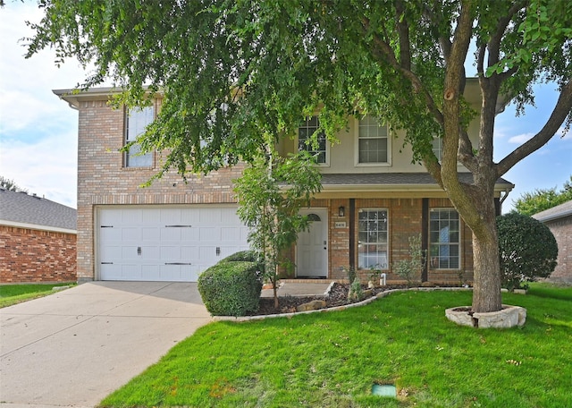 view of front of home with a front yard, brick siding, a garage, and driveway