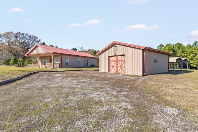 exterior space featuring a carport and covered porch