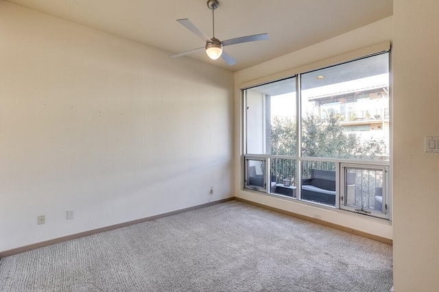 spare room with ceiling fan and carpet flooring