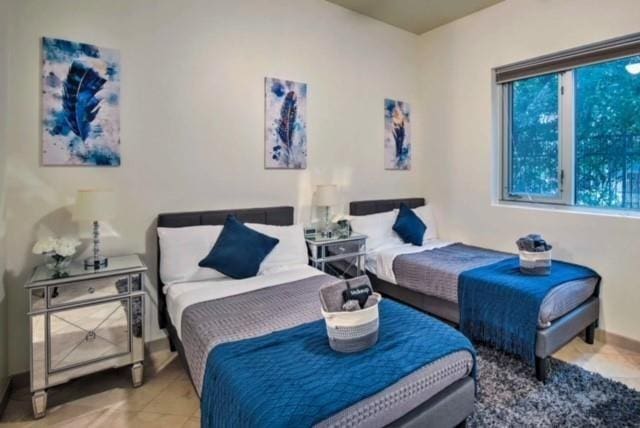 bedroom featuring light tile patterned floors