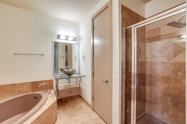 bathroom featuring vanity, tile patterned flooring, and separate shower and tub