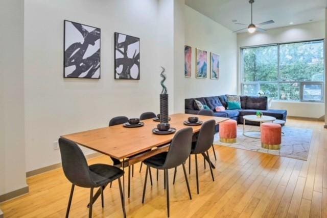 dining room featuring ceiling fan and light hardwood / wood-style floors