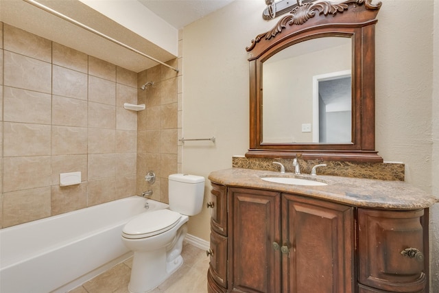 full bathroom with tiled shower / bath combo, vanity, tile patterned floors, and toilet