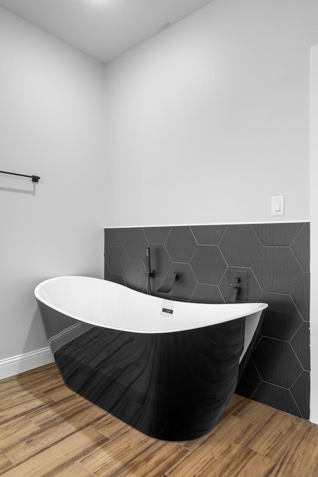 bathroom with a tub to relax in