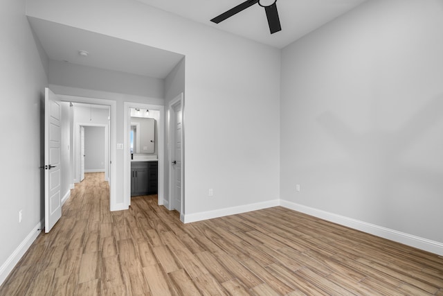 spare room with ceiling fan and light hardwood / wood-style flooring