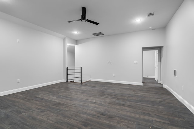 unfurnished room with ceiling fan and dark hardwood / wood-style flooring