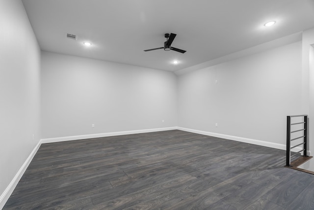 spare room with dark hardwood / wood-style floors and ceiling fan