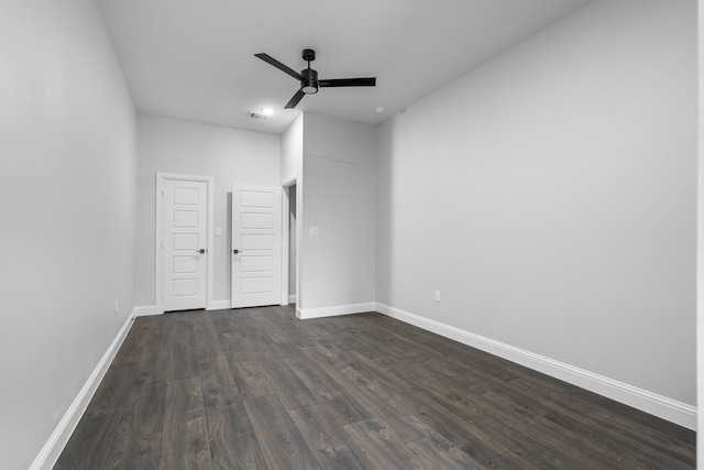 empty room featuring dark hardwood / wood-style floors and ceiling fan