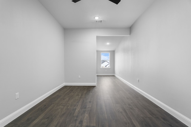 empty room featuring dark hardwood / wood-style flooring