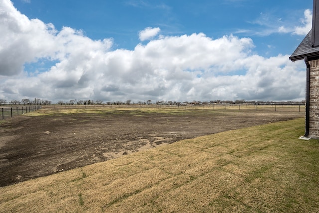 view of yard with a rural view