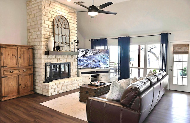 living room featuring a fireplace, dark hardwood / wood-style floors, ceiling fan, and lofted ceiling