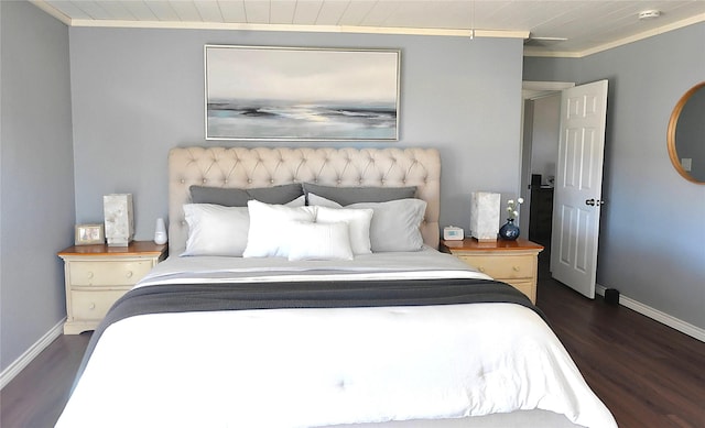 bedroom featuring crown molding and dark wood-type flooring