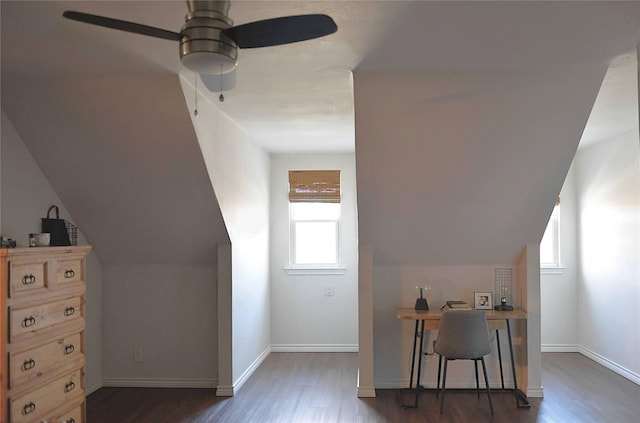 bonus room featuring dark hardwood / wood-style floors, ceiling fan, and a healthy amount of sunlight