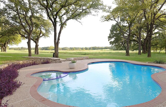 view of swimming pool featuring an in ground hot tub