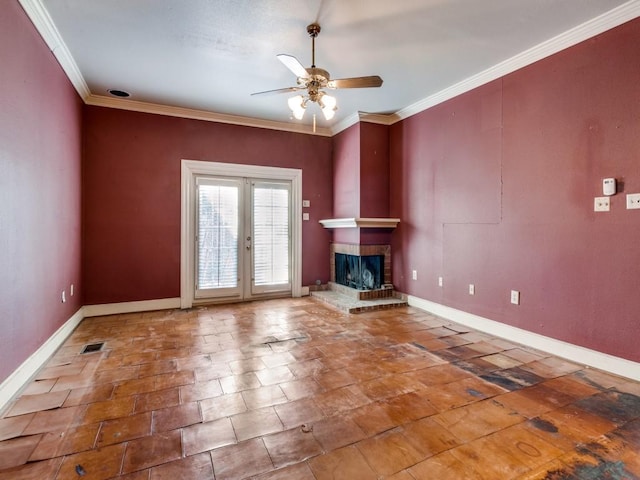 unfurnished living room featuring crown molding, ceiling fan, a fireplace, and french doors