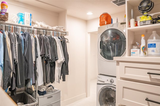 washroom with stacked washer and dryer