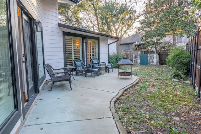 view of patio / terrace featuring a fire pit