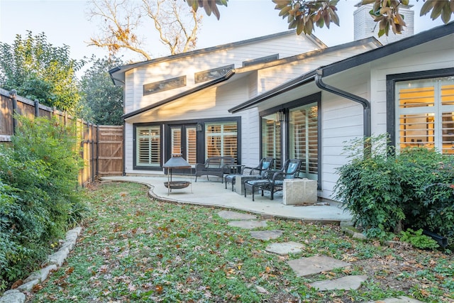 back of house featuring a patio area