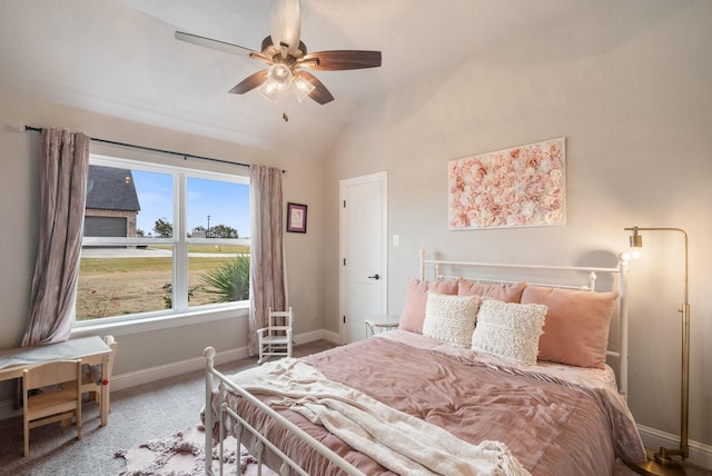 bedroom with ceiling fan, carpet floors, and vaulted ceiling