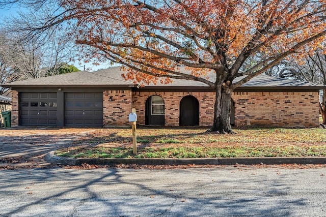 single story home with a garage