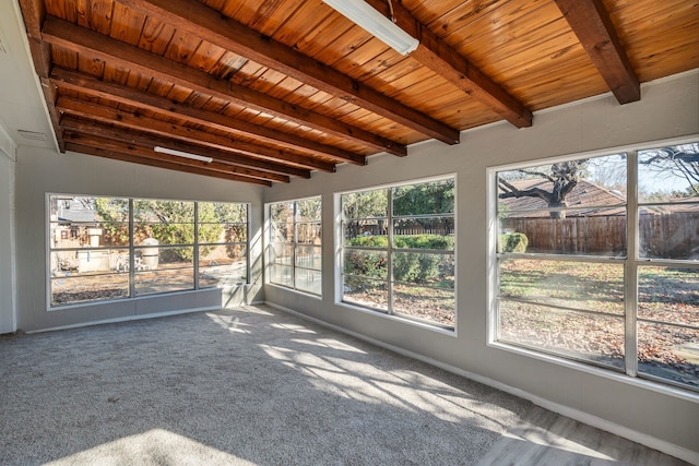 unfurnished sunroom featuring wood ceiling and beam ceiling