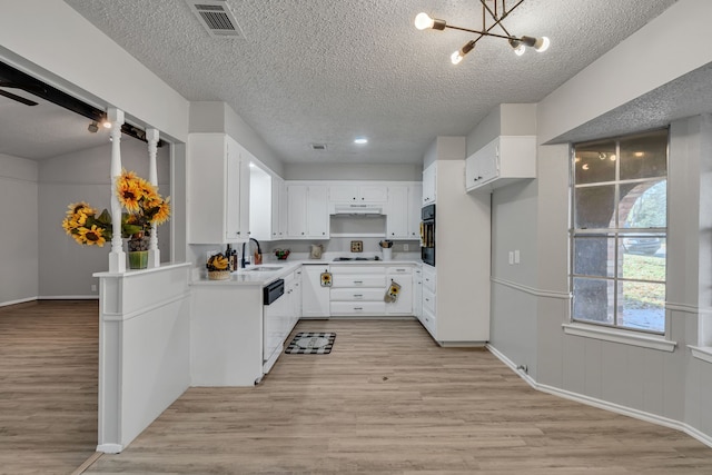 kitchen featuring white cabinetry, sink, white appliances, and light hardwood / wood-style floors