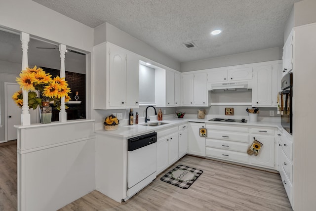 kitchen with sink, white cabinets, white appliances, and light hardwood / wood-style floors