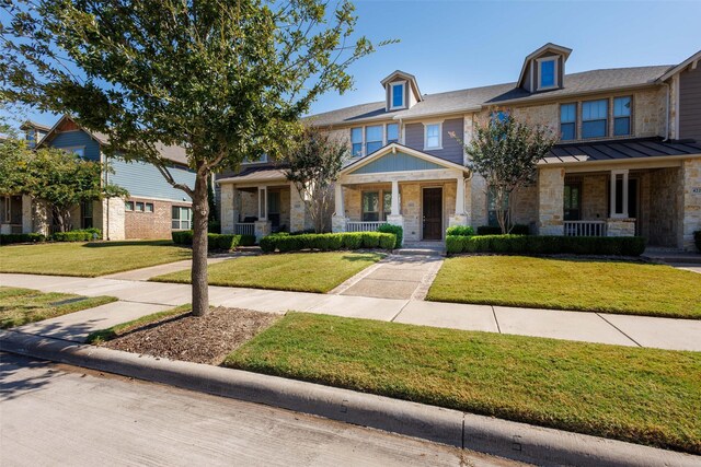 view of front of home featuring a porch and a front lawn