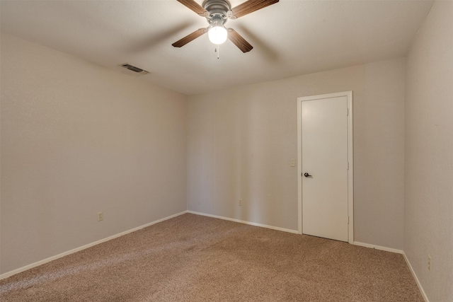 carpeted empty room with ceiling fan