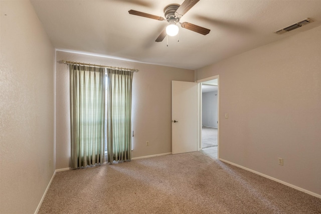 2818 Happy Hollow Dr, Wichita Falls, TX 76308 - unfurnished room featuring a ceiling fan, light colored carpet, and baseboards