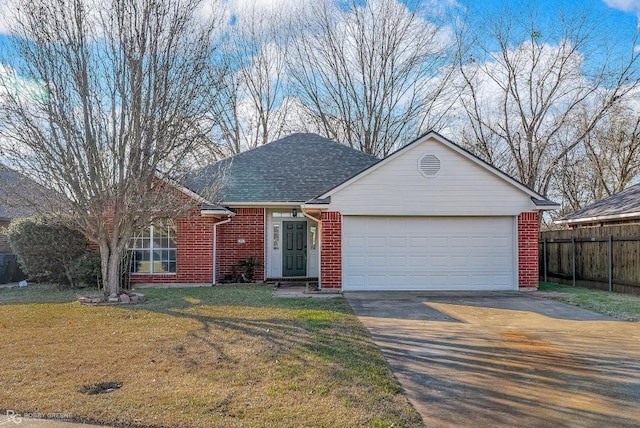 ranch-style home with a front yard and a garage