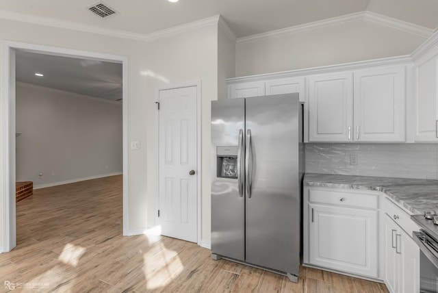 kitchen featuring white cabinetry, stainless steel fridge with ice dispenser, crown molding, and backsplash